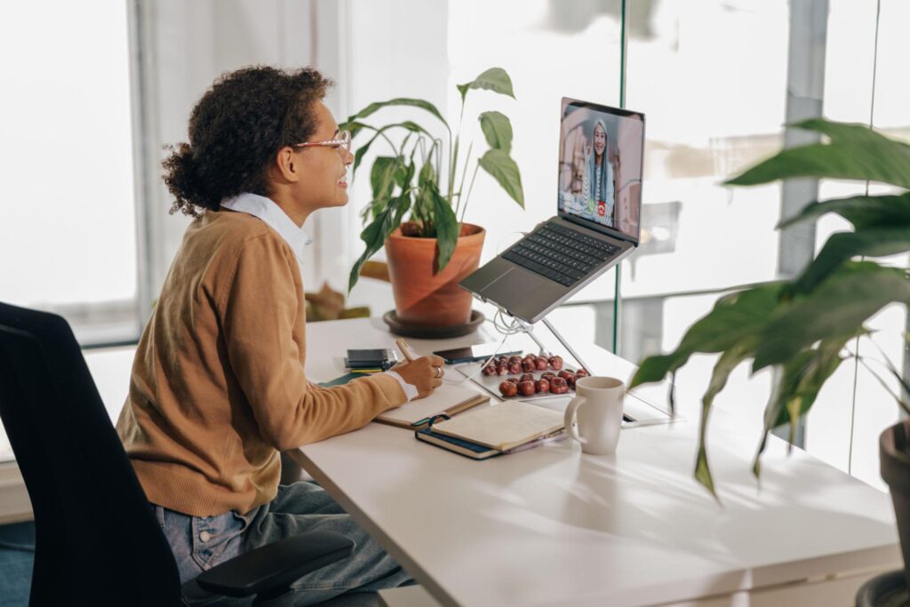 Professional attending an online meeting from a home office
